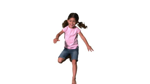 Joyful Girl Jumping High in Sunlit White Space