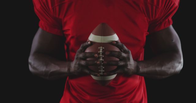 Football Player Holding Football Close Up on Black Background - Download Free Stock Images Pikwizard.com