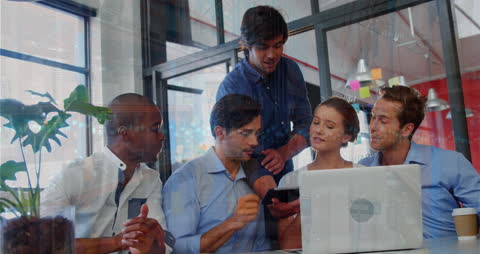 Diverse Team Discusses Data Strategies in Modern Office Space