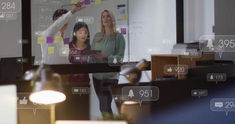 Marketing team collaborating over sticky notes and tablet with notification overlays