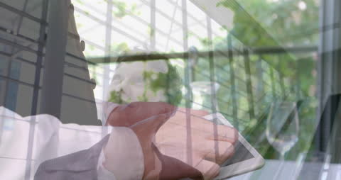 Businessman Using Tablet with Nature Reflections