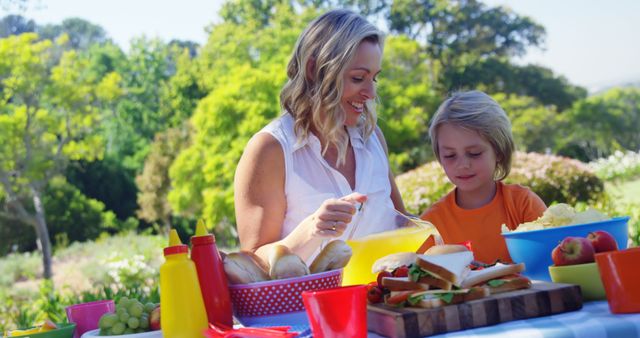 Mother and Son Enjoying Outdoor Picnic in Sunny Park - Download Free Stock Images Pikwizard.com