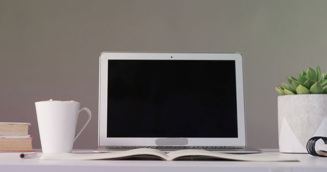 Modern Workspace with Laptop, Coffee Mug, and Office Supplies - Download Free Stock Images Pikwizard.com