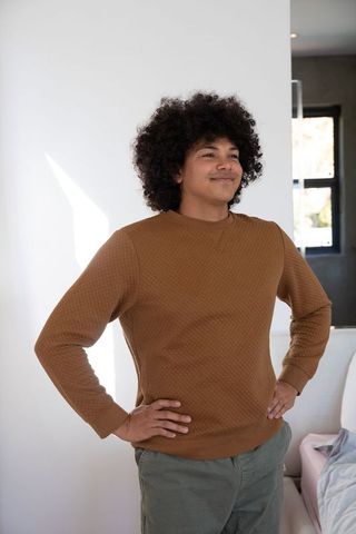 Confident Man Standing in Contemporary Bedroom