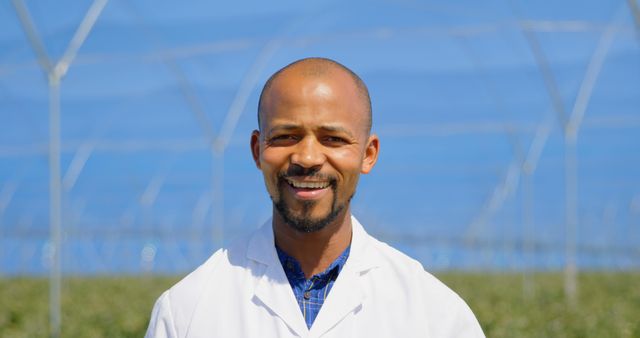 Agricultural Scientist Smiling in Greenhouse - Download Free Stock Images Pikwizard.com