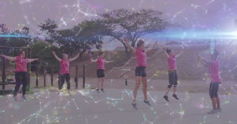 Women Exercising Outdoors in Synchrony, Embodying Health and Fitness Motivation