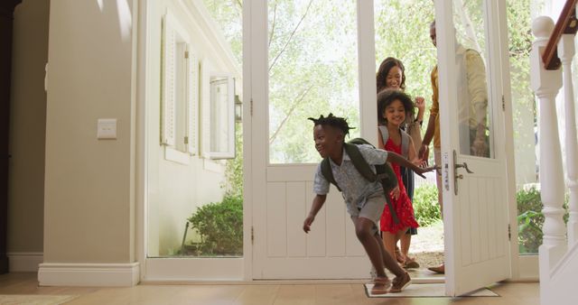 Happy Family with Children Entering Home on a Sunny Day - Download Free Stock Images Pikwizard.com