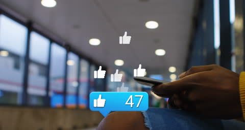 Man Using Smartphone with Social Media Like Icons