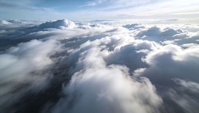 Gliding Above Sunlit Cumulus and Stratocumulus Layers with Cirrus Highlights