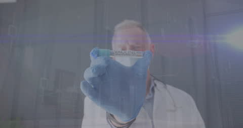 Doctor Displaying COVID-19 Vaccine with Data Analytics Overlay