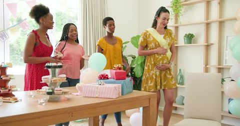 Joyful Baby Shower Celebration with Diverse Friends Exchanging Gifts