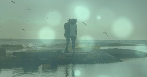 Romantic Biracial Couple Enjoying Scenic Beach Sunset