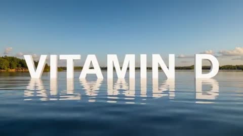 VITAMIN D letters floating and reflecting on calm lake with golden hour light