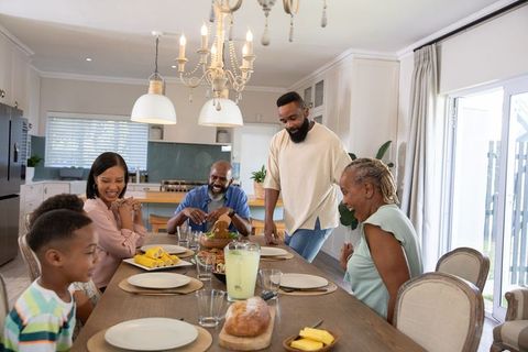 Multigenerational Family Enjoying Cozy Dining Experience at Home