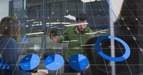 Business Professionals Analyzing Data Graphs and Charts with Technology