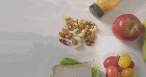 Healthy snack arrangement with nuts and fresh fruits