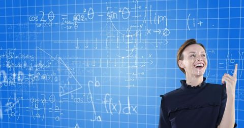 Enthusiastic woman solving math equations on virtual board