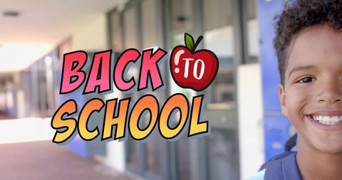 Smiling student with back to school text in school hallway