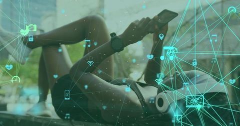 Woman Enjoying Smartphone with Digital Media Icons Overlaid