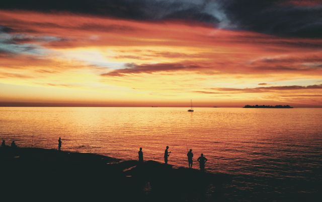 People Fishing by Ocean at Sunset with Scenic View - Download Free Stock Photos Pikwizard.com