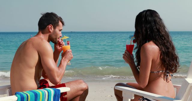 Couple Relaxing by Beach Drinking Beverages and Enjoying Vacation - Download Free Stock Images Pikwizard.com