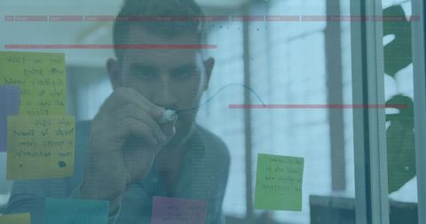 Businessman Innovatively Analyzing Data on Transparent Board