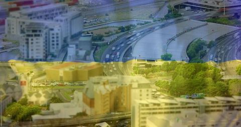 Aerial multilane interchange carrying traffic with blue yellow overlay