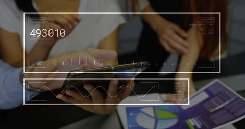 Coworkers Analyzing Digital Data on Mobile Devices