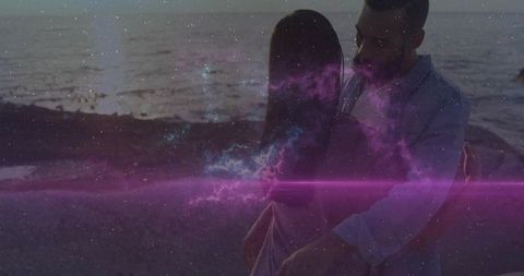 Couple Embracing at Dusk with Cosmic Nebula Effect by Sea