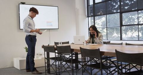 Diverse colleagues engaged in business meeting discussing strategies