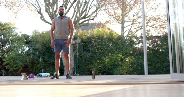 Man Preparing for Outdoor Fitness Routine in Backyard - Download Free Stock Images Pikwizard.com