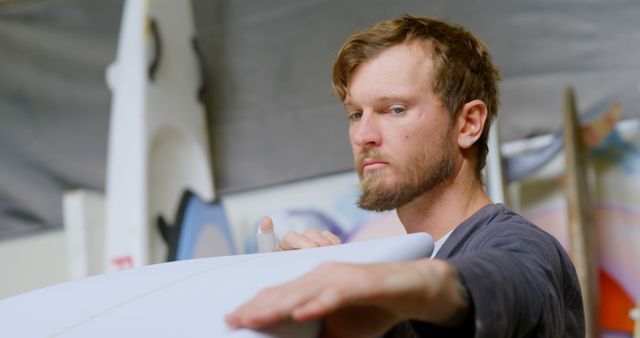 Focused Craftsman Shaping Surfboard in Workshop - Download Free Stock Images Pikwizard.com