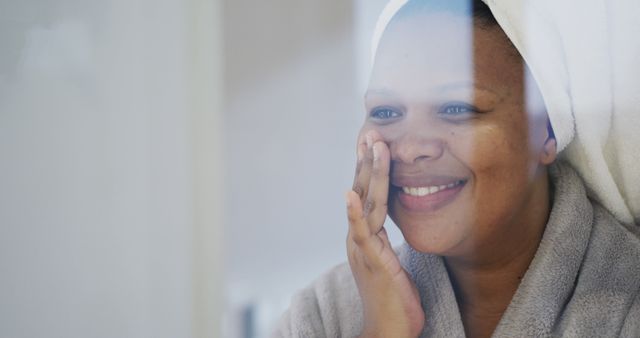 Woman Enjoying Daily Skincare Routine with Towel Wrapped Around Her Head - Download Free Stock Images Pikwizard.com