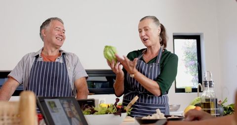 Senior Couple Sharing Joy in Healthy Cooking Together
