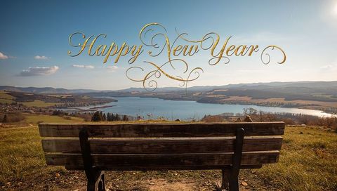 Happy New Year Golden Calligraphy Over Lakeside Bench Facing Panoramic Countryside View