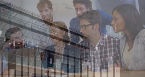 Innovative Business Team Analyzing Financial Data on Laptop