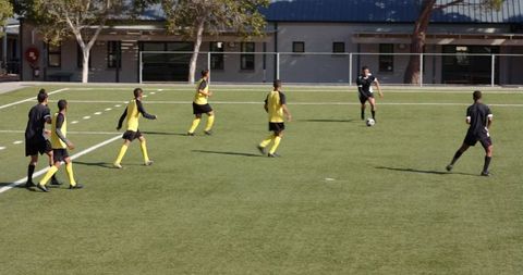 Youth Soccer Players Competing in Outdoor Match Action Scene