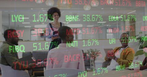 Dynamic Business Team Analyzing Financial Data in Modern Office