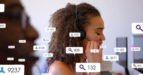Call center agent adjusting headset with digital notifications and teamwork insights