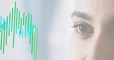 Indian professional woman gazing at digital data visualization with focused analytical eye