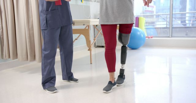 Physiotherapist Assisting Patient with Prosthetic Leg During Rehabilitation - Download Free Stock Images Pikwizard.com