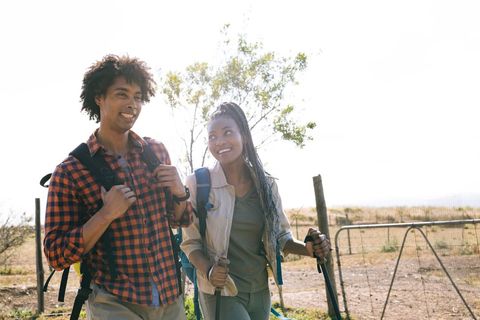 Happy Couple Enjoying Sunny Outdoor Hiking Adventure
