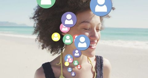 Digital connection and social media overlaid on smiling woman at beach
