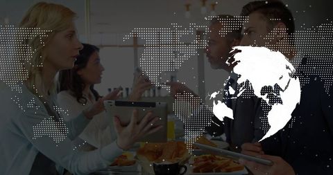 Business professionals discussing strategy with digital tablets and world map overlay