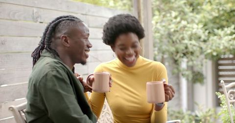 Relaxed African American Couple Enjoying Coffee Break Outdoors