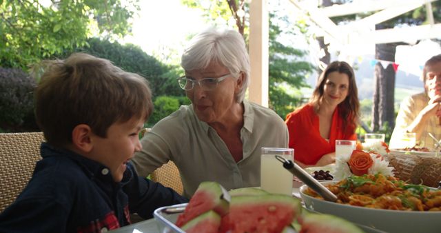 Happy Family Gathering Outdoors Sharing Meal and Creating Memories - Download Free Stock Images Pikwizard.com