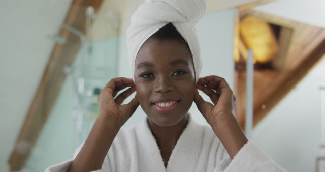 Young Woman with Towel Wrapped Hair Relaxing in Bathroom - Download Free Stock Images Pikwizard.com