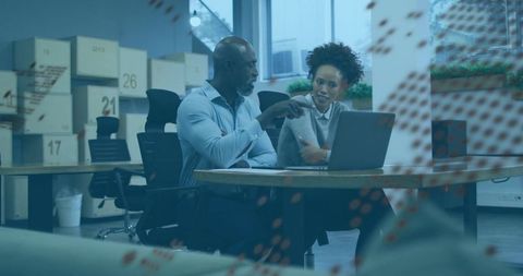 Colleagues Collaborating in Modern Industrial Warehouse Office
