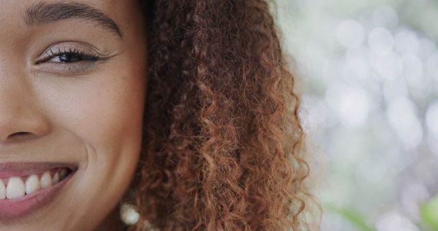 Half Smiling Face of Young Woman with Curly Hair - Download Free Stock Images Pikwizard.com