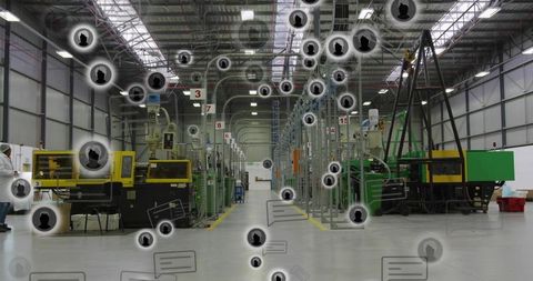 Factory technician inspecting injection molding line with digital connectivity overlays